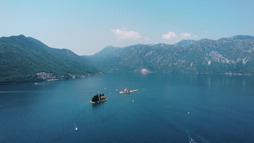 Serene coastal landscape scene. Vast mountain bay overlooking islands close to Perast with tranquil blue waters