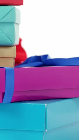 Stack of wrapped gift boxes against white background