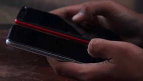 Sync and backup data, Close up of hands holding two smartphones transferring data between devices, mobile file sharing and wireless connection, syncing files, messages and contacts. - Powered by Shutterstock - Get 15% off with code: PIKWIZARD15