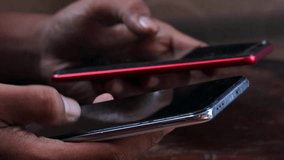 Sync and backup data, Close up of hands holding two smartphones transferring data between devices, mobile file sharing and wireless connection, syncing files, messages and contacts. - Powered by Shutterstock - Get 15% off with code: PIKWIZARD15