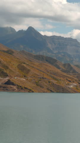 Quiet Water Reflection Scene, Peaceful Landscape Featuring Mountains And Calm Water Under Sunny Sky. Creative