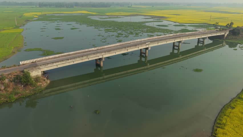 Long bridge spanning over flooded landscape