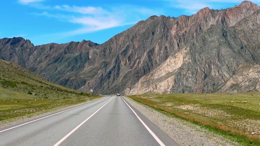 Road of Chuysky Trakt running along Katun River Altai Russia. Scenic route following Siberian mountain river through natural landscape. High quality 4k footage