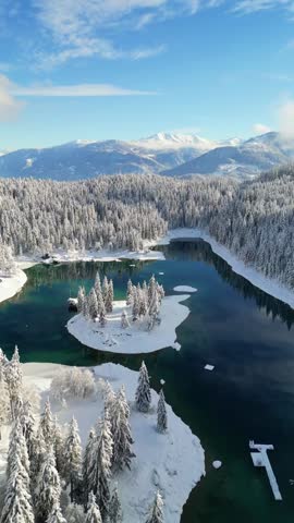 Caumasee Lag la Cauma turquoise-colored alpine lake in Flims, Switzerland winter snow covered