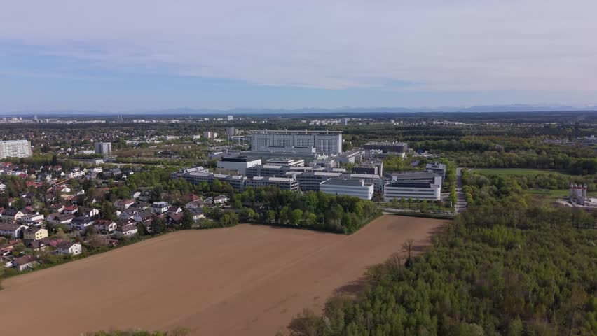 Drone view of large hospital complex LMU Klinikum in Munich, Bavaria. European university hospital, medical center, healthcare system infrastructure and academic research facility.