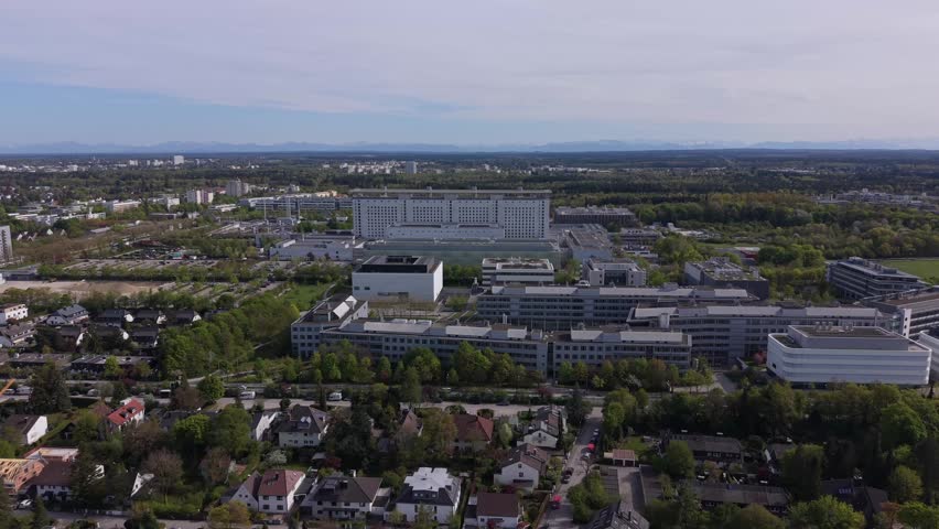 Panoramic aerial view of Munich with LMU Klinikum hospital complex. Modern European healthcare facility, university clinic and medical campus in Bavarian capital.
