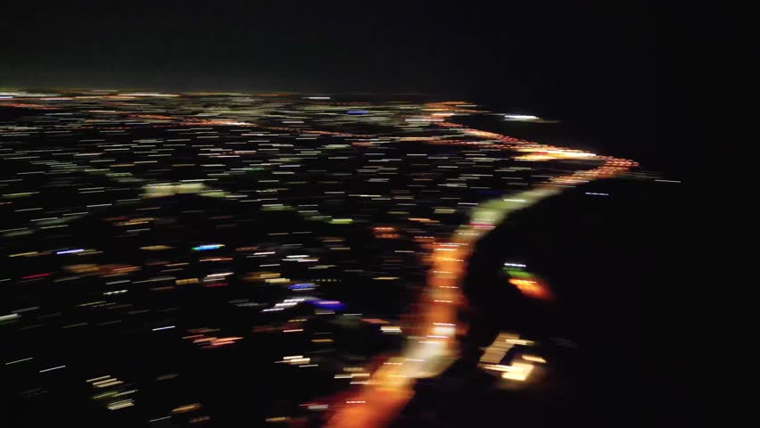Aerial drone footage of the suburb of Brighton in Melbourne Australia at night.