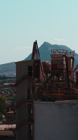 Abandoned industrial factory showing a decaying structure against a clear sky