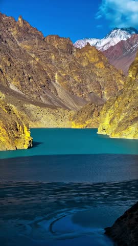 Vertical Video Snow Covered Mountain Peaks With Turquoise Lake Pakistan Scenic Nature Landscape 4K Footage