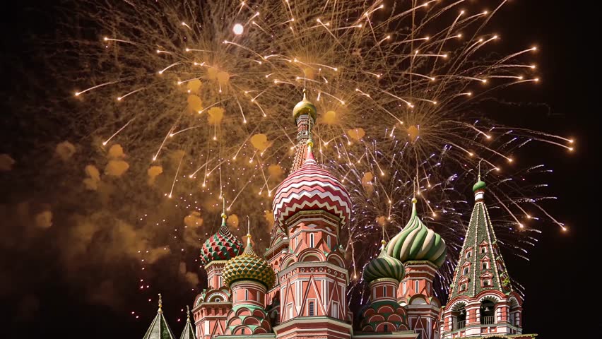 Temple of Basil the Blessed and fireworks in honor of Victory Day celebration (WWII), Red Square, Moscow, Russia. Time lapse 