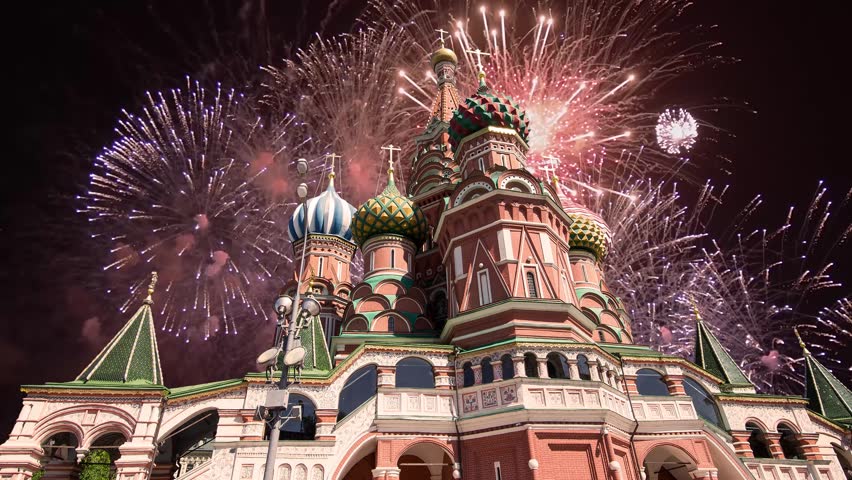 Temple of Basil the Blessed and fireworks in honor of Victory Day celebration (WWII), Red Square, Moscow, Russia. Time lapse 