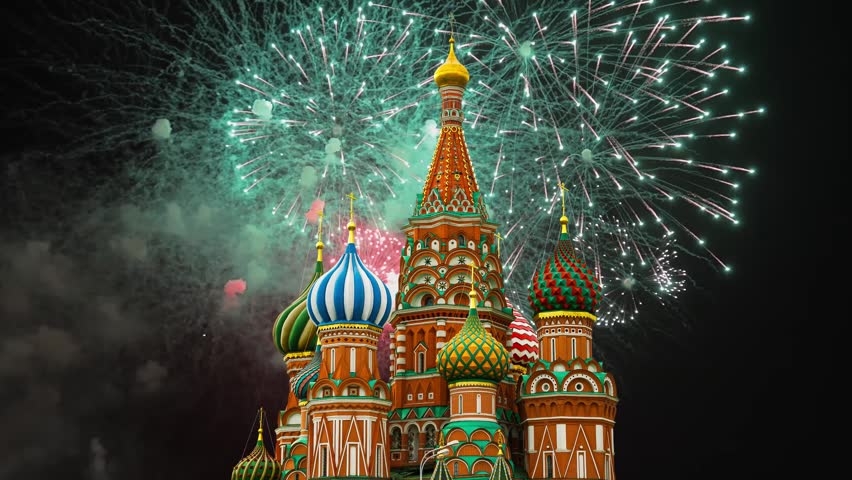 Temple of Basil the Blessed and fireworks in honor of Victory Day celebration (WWII), Red Square, Moscow, Russia. Time lapse 