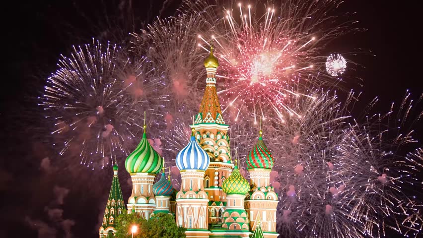 Temple of Basil the Blessed and fireworks in honor of Victory Day celebration (WWII), Red Square, Moscow, Russia. Time lapse 