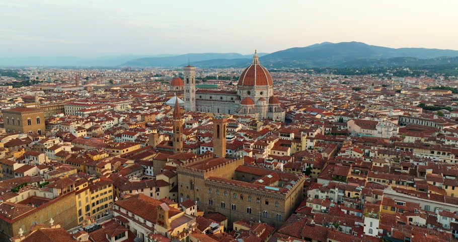 Aerial drone panorama Florence Italy historic old town landmarks Cathedral Duomo red roofs pattern summer daylight travel tourism Tuscany scenic urban view