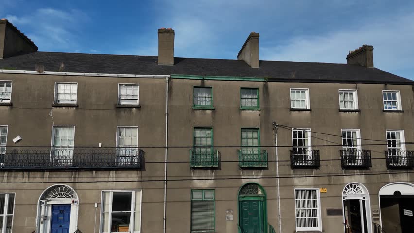 Scenic footage of elegant Georgian architecture in Dundalk captured on a crisp, bright winter’s day. The video highlights classic period buildings with symmetrical design, sash windows, and historic charm, reflecting Ireland’s rich architectural heritage. Ideal for themes of history, travel, urban landscapes, and European culture.