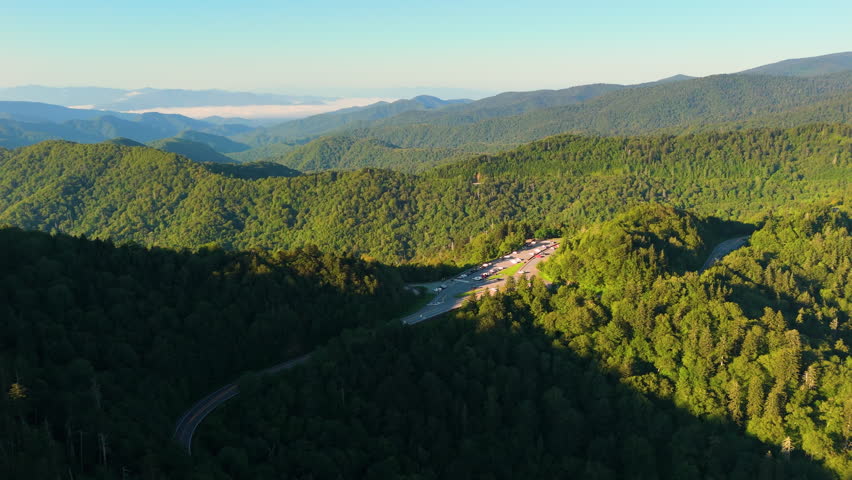 Car travel in Great Smoky Mountains. Newfound Gap overlook parking in in summer. Mountain pass along the border of Tennessee and North Carolina.