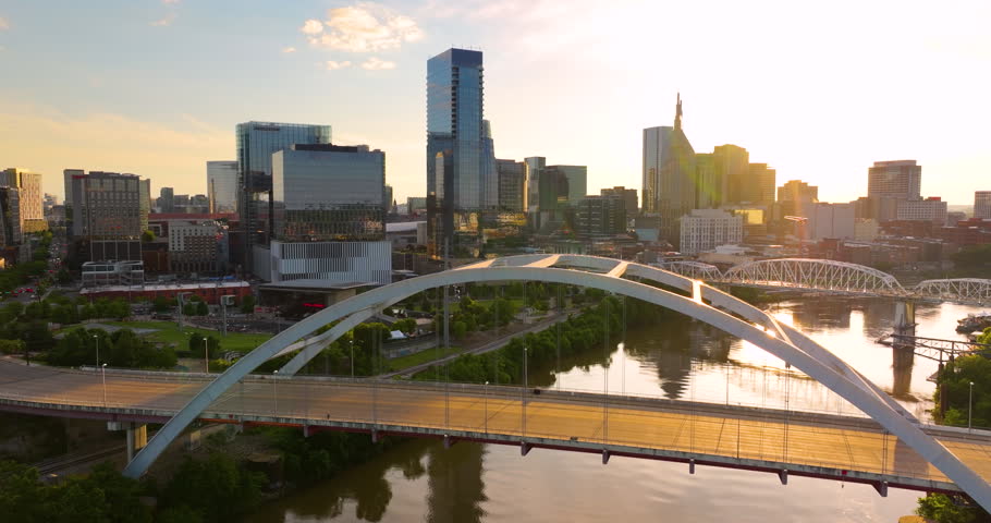 Highway traffic with driving cars on Korean Veterans Memorial Bridge in downtown district of Nashville city in Tennessee, USA.