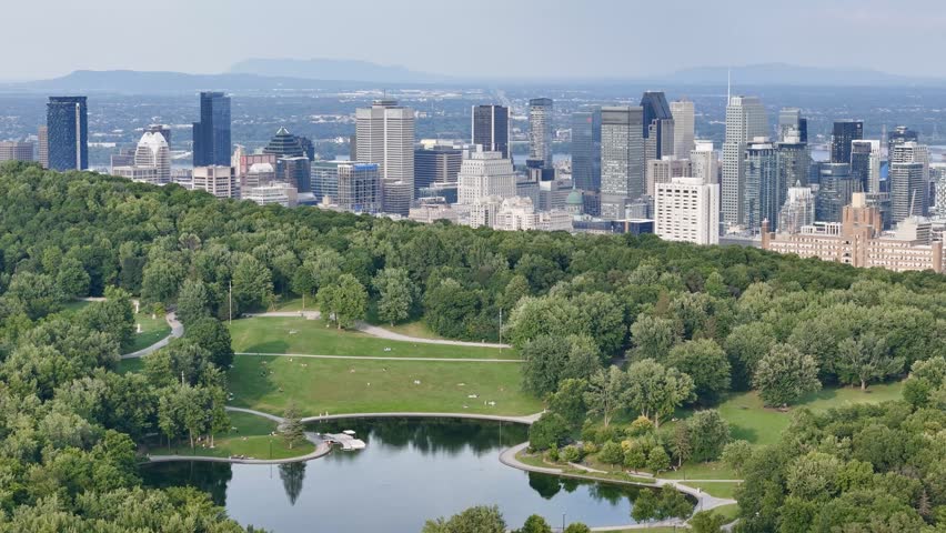 Montreal skyline from Mount Royal with park, lake and greenery in summer, Quebec, Canada. g.