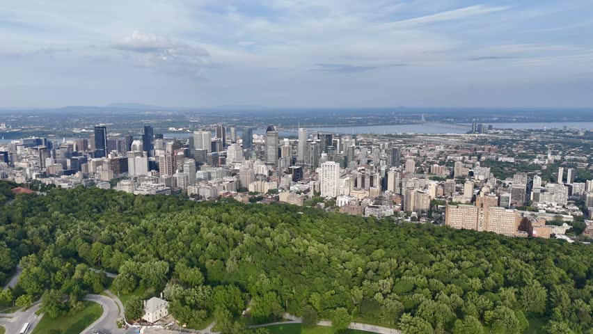 Montreal skyline from Mount Royal with park, lake and greenery in summer, Quebec, Canada. g.