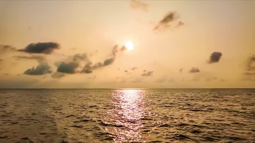 Serene Seascape Under Cloudy Skies: A tranquil ocean stretches endlessly towards the horizon, beneath a vast expanse of dramatic, cloud-filled skies, creating a sense of peace and contemplation.