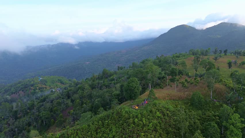 Aerial View of Campers on a Hilltop Overlooking Mountains
