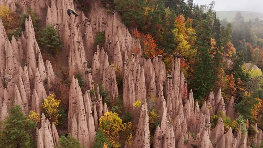 Earth pyramids of Platten at daytime, aerial view, at autumn season time.