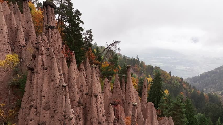 Earth pyramids of Platten at daytime, aerial view, at autumn season time.