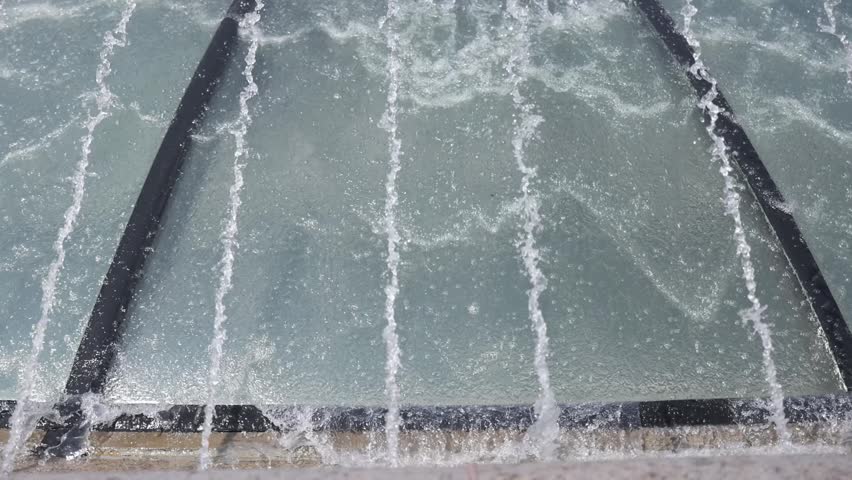 Modern urban fountain close-up. Water jets