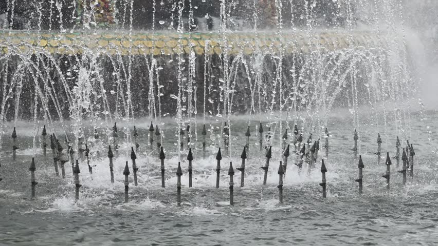 Modern urban fountain close-up. Water jets