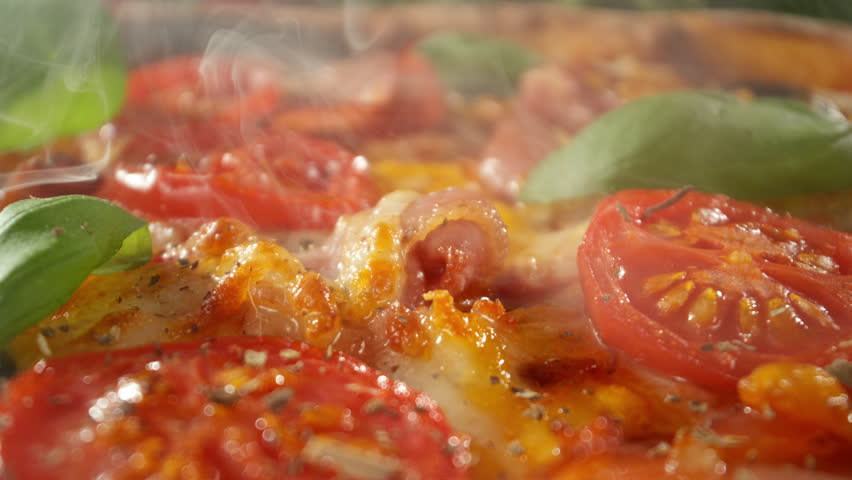 Appetizing Piece of Pizza Prepared for Eating , Camera Passing Just Above the Pizza , Unique Angle of View , Super Slow Motion