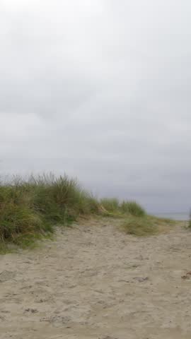 Tranquil isolated beach scene on a cloudy day