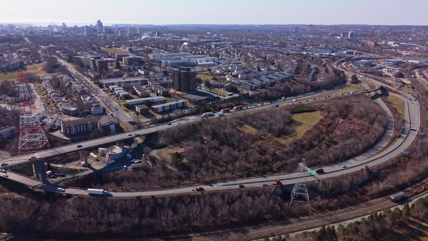 Aerial View Highway Interchange Leading To Bridge In Halifax Nova Scotia Canada Morning Traffic Flow Urban Transport Infrastructure Commuter Vehicles City Scene 4K