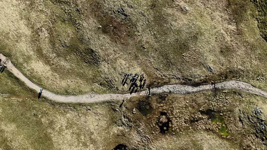 Aerial drone view of a footpath that leads to the summit of Helvellyn, the third highest peak in England, in the Lake District National Park on a bright sunny spring day, Cumbria, UK