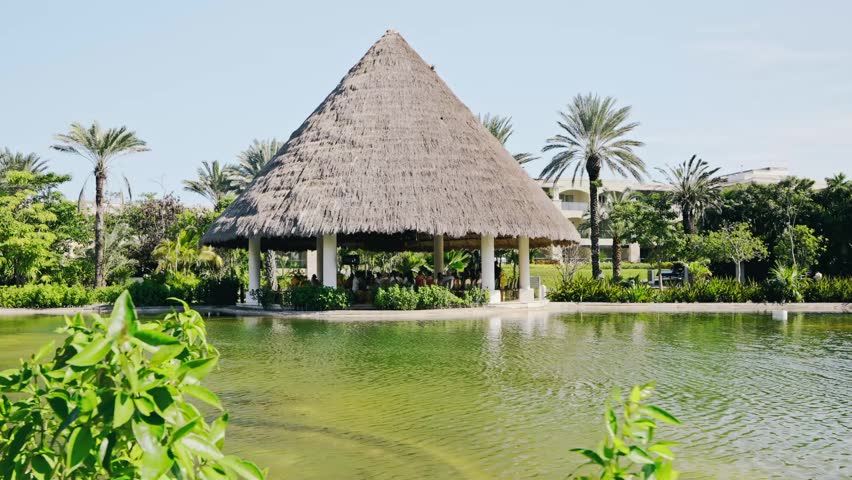 Tropical Palapa by Lagoon in Luxury Resort Garden Relaxing Outdoor Pavilion Mexico
