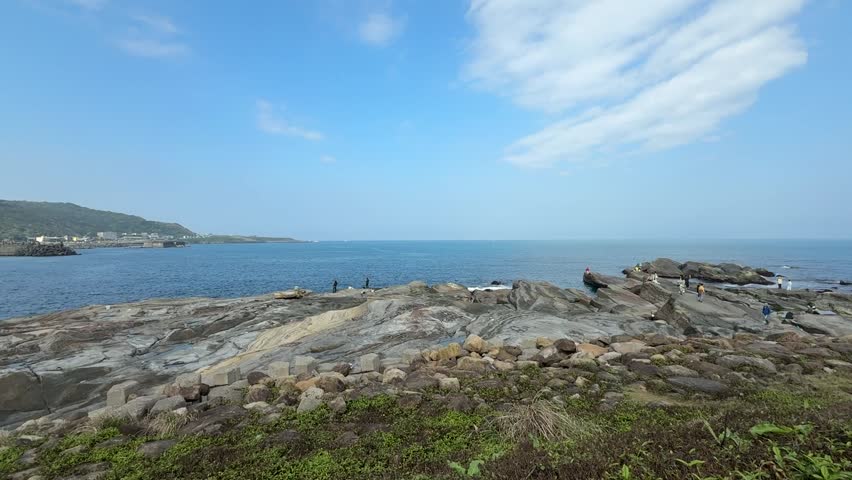 A scenic viewing area with rugged terrain and vast ocean outlook. It