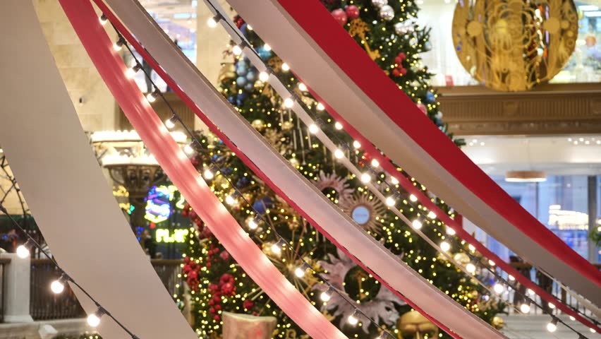 Christmas and New Year lights decorating a large shopping mall interior