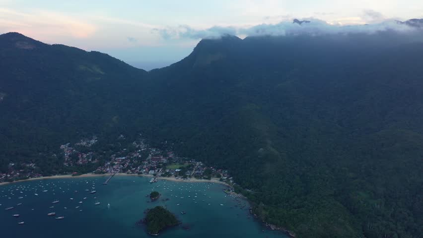 Stunning aerial panoramic view of Rio de Janeiro, Brazil featuring iconic coastline, sandy beaches, Atlantic Ocean, and urban skyline. Scenic tropical city landscape and famous travel destination.