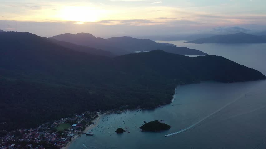 Stunning aerial panoramic view of Rio de Janeiro, Brazil featuring iconic coastline, sandy beaches, Atlantic Ocean, and urban skyline. Scenic tropical city landscape and famous travel destination.