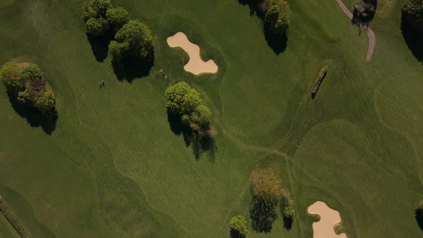 Green Golf Course Aerial View With Trees and Sand Bunkers