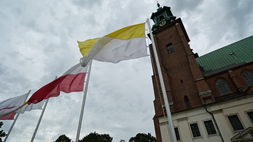 Waving Poland And Vatican Flags Near Gniezno Cathedral
