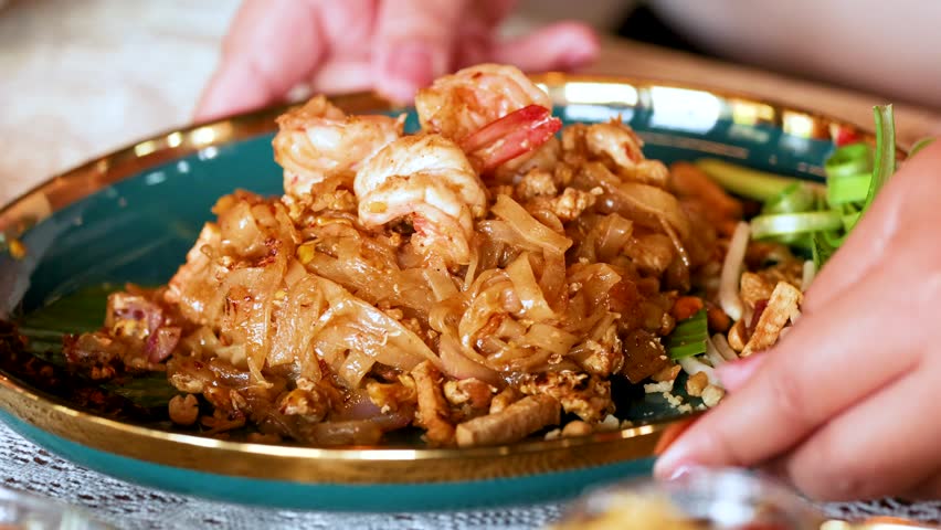 Close up of delicious stir fried rice noodles with shrimp.