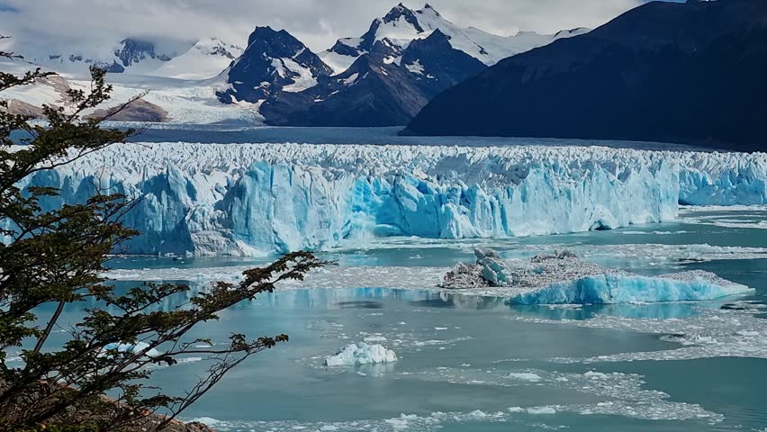 Perito Moreno Glacier in Los Glaciares National Park, Argentina, dramatic calving event with massive ice blocks breaking off and crashing loudly into Lago Argentino, a UNESCO World Heritage site