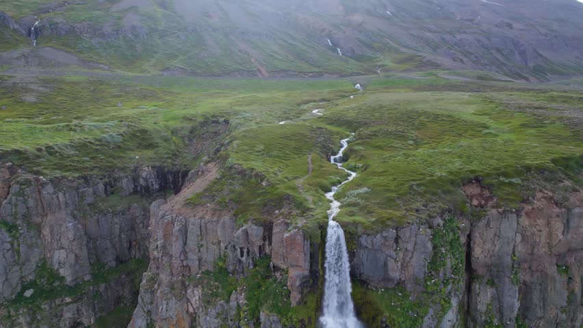 A breathtaking waterfall cascading in natural surroundings.