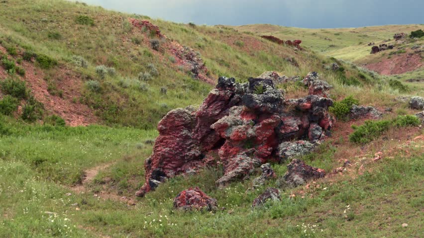 Nebraska badlands geology, dry hills and erosion formations with rock outcrops, USA