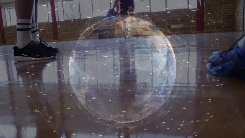 Three basketball players dribbling and driving while globe overlay blending over players, scoring. Ball, court, gym, action, competition, teamwork, intensity