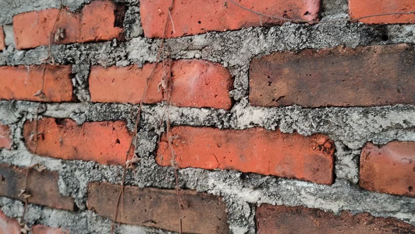 ancient red brick wall texture with rough weathered surface