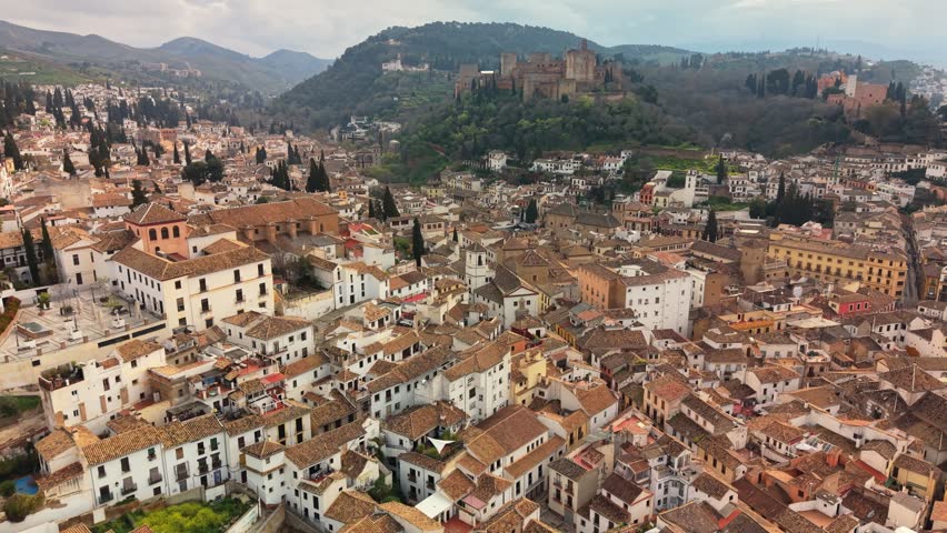 Panoramic shot of Granada city in Spain reveals the charm of the Albaicin neighborhood. beautiful landscape of Granada with the Alhambra fortress in the background, Spain