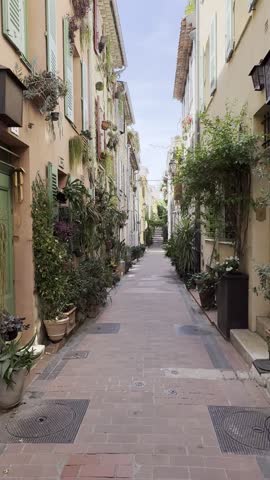 typical flower-filled alleyway in old Antibes- old Town - French Riviera - South of France