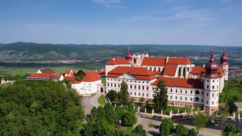 Explore Gottweig Abbey in Austria from the sky. This historic site showcases stunning architecture amidst beautiful natural landscapes, providing breathtaking views and rich history.