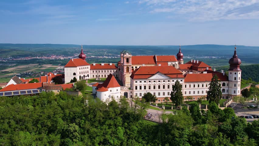 Explore Gottweig Abbey in Austria from the sky. This historic site showcases stunning architecture amidst beautiful natural landscapes, providing breathtaking views and rich history.